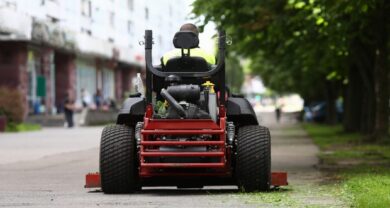 Rear view of red ride-on mower